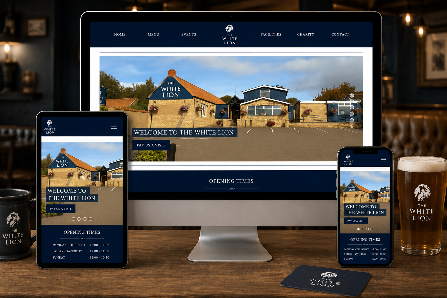 The White Lion responsive Joomla! website displayed across desktop, tablet and mobile devices in a stylish traditional pub setting.